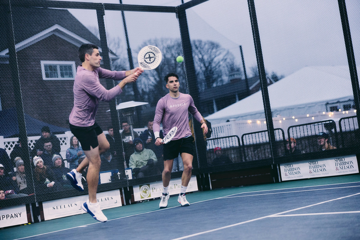 Jose Salazar hitting an overhead alongside Alvaro Regalado at the APTA Men’s National Championship